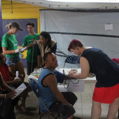 Volunteers helping to check the blood of locals in Belize Projects Abroad volunteers checking blood as part of her Spring Break Public Health Project in Belize